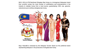Advertisement featuring Malaysian flag, honey brand logo, and people in traditional attire with text about honey brand endorsement. Bayu Kelulut is endored by the Malaysia Tourism Board